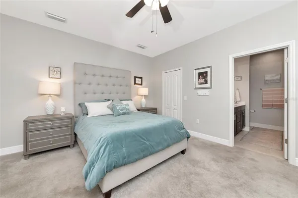a bedroom with a bed and closet