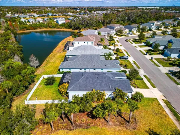 an aerial view of a house with a swimming pool