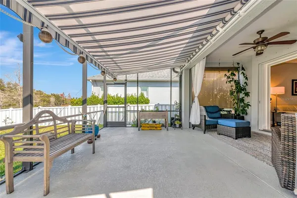 a swimming pool with outdoor seating
