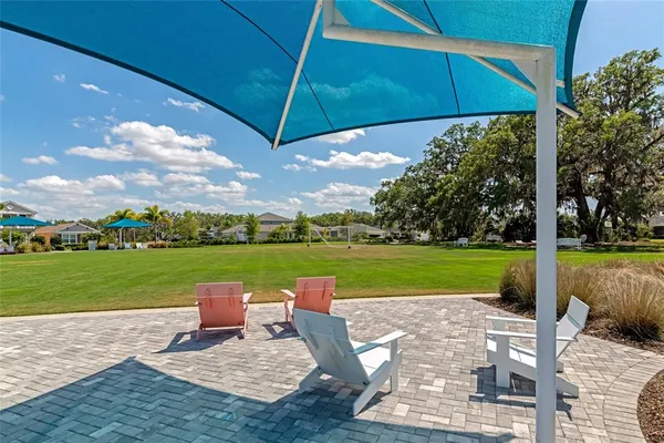 an aerial view of residential house with outdoor space and parking
