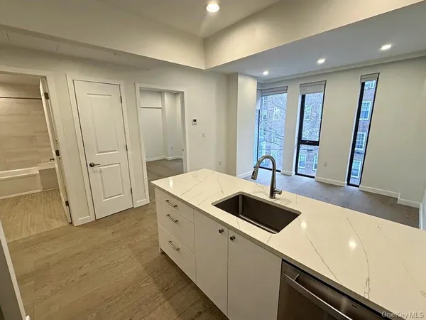 a view of a kitchen with a sink and dishwasher