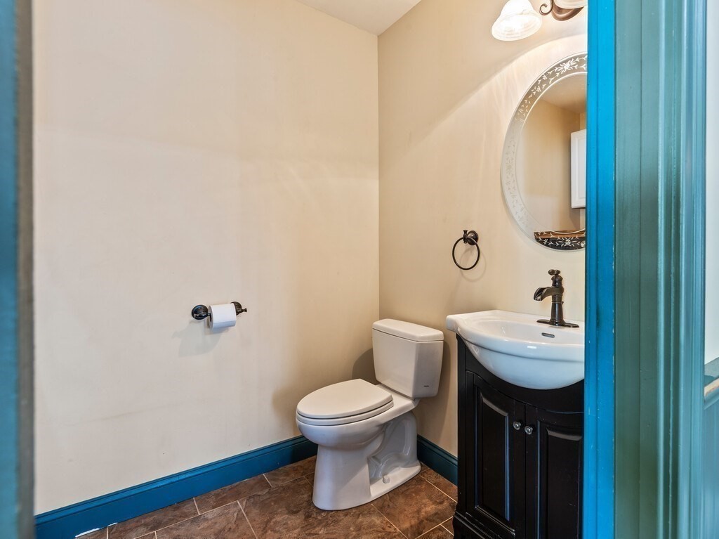 1082 Old Dana Road Barre, MA 01005 - Photo 11 of 42 a bathroom with a sink a toilet and a mirror