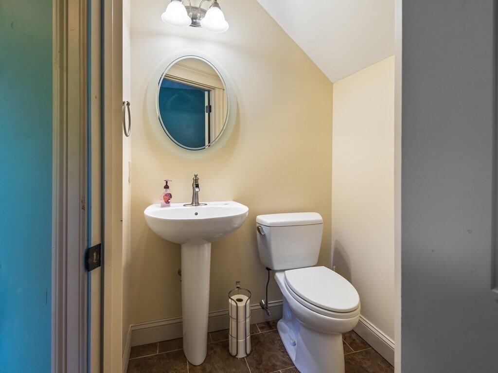1082 Old Dana Road Barre, MA 01005 - Photo 23 of 42 a bathroom with a toilet sink and mirror
