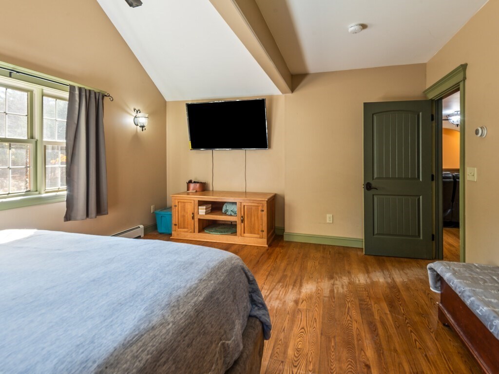 1082 Old Dana Road Barre, MA 01005 - Photo 25 of 42 a bedroom with a bed and a flat screen tv