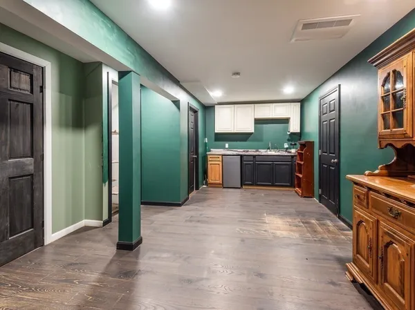 a open kitchen with stainless steel appliances granite countertop a refrigerator and stove