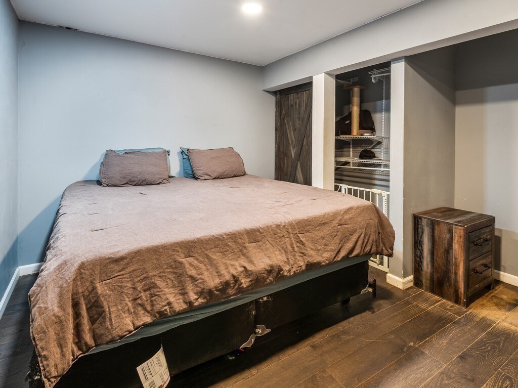 1082 Old Dana Road Barre, MA 01005 - Photo 35 of 42 a bed sitting in a bedroom next to a window