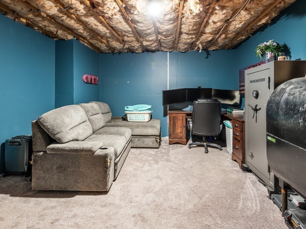 1082 Old Dana Road Barre, MA 01005 - Photo 37 of 42 a living room with furniture a flat screen tv and a chair