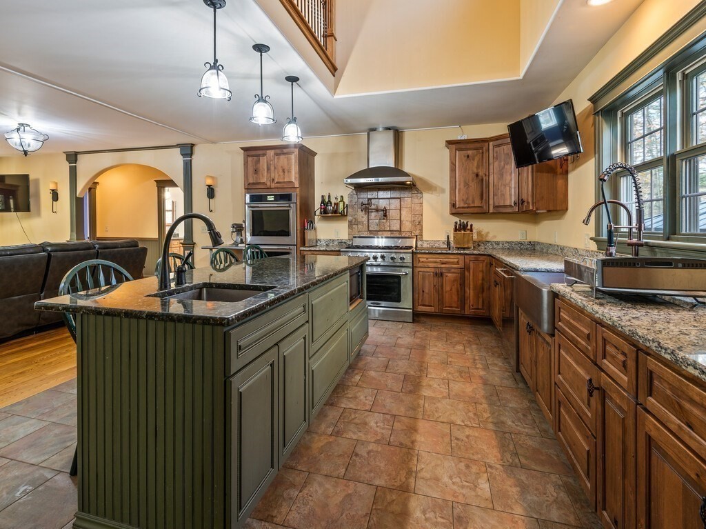 1082 Old Dana Road Barre, MA 01005 - Photo 6 of 42 a kitchen with stainless steel appliances granite countertop a sink a stove and a refrigerator