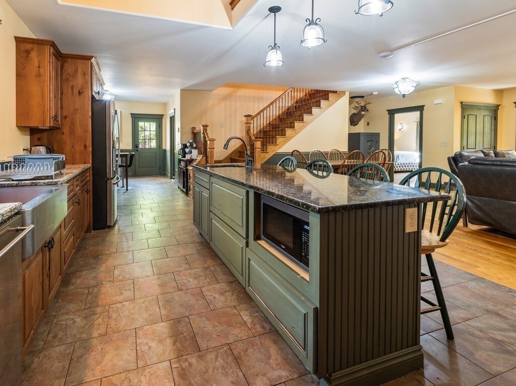 1082 Old Dana Road Barre, MA 01005 - Photo 8 of 42 a kitchen with stainless steel appliances granite countertop a stove and a sink