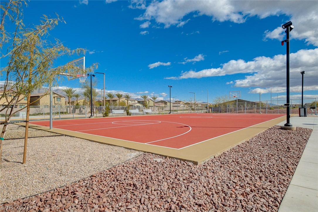 7330 North Decatur Boulevard, Unit 6 North Las Vegas, NV 89084 - Photo 40 of 42 An inviting outdoor basketball court awaits, perfect for active recreation under clear skies.