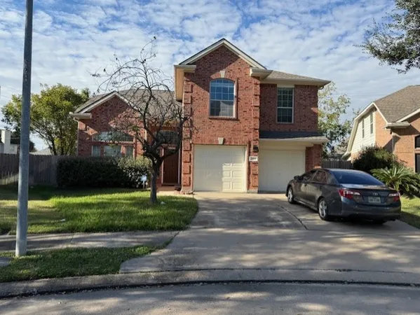 a car parked in front of a house
