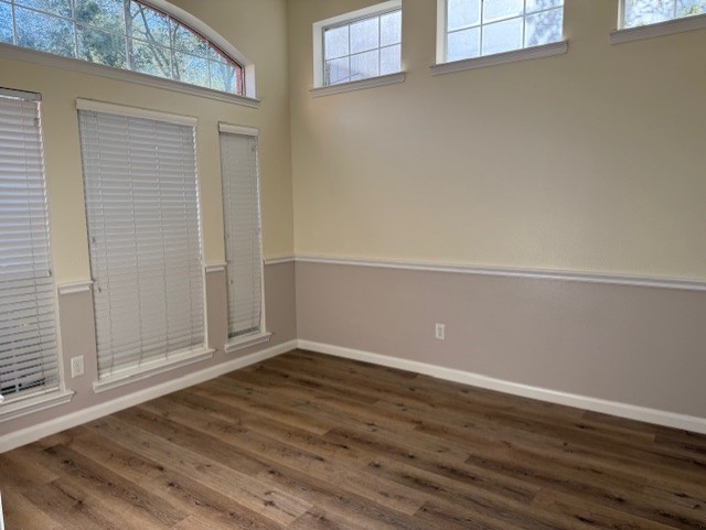 5603 Lowellberg Lane Houston, TX 77084 - Photo 4 of 10 an empty room with wooden floor