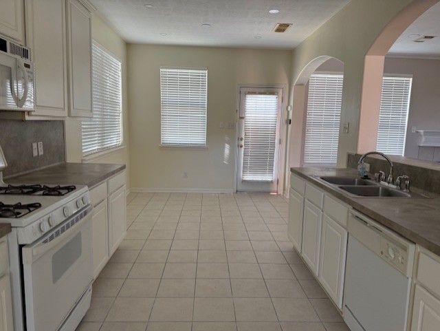 5603 Lowellberg Lane Houston, TX 77084 - Photo 7 of 10 a kitchen with a sink stove and cabinets