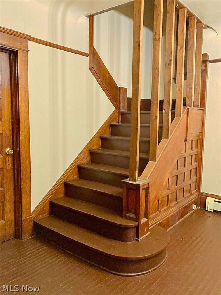 554 Eddy Road Cleveland, OH 44108 - Photo 25 of 32 Stairs with wood finished floors and baseboard heating