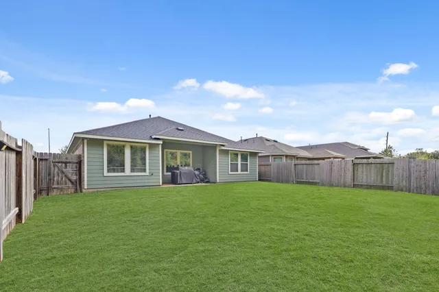 a view of a yard in front of a house with a yard