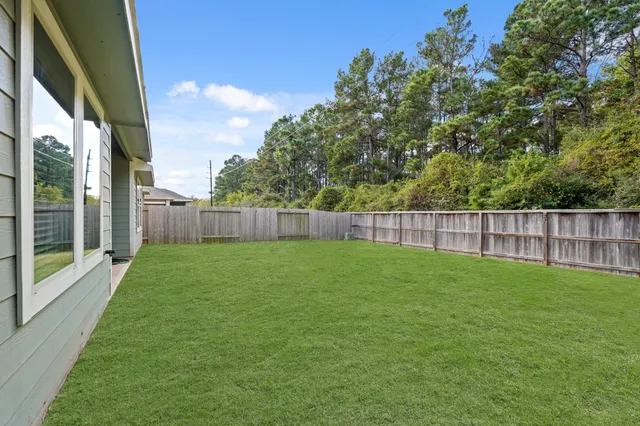 a view of a yard with a trampoline