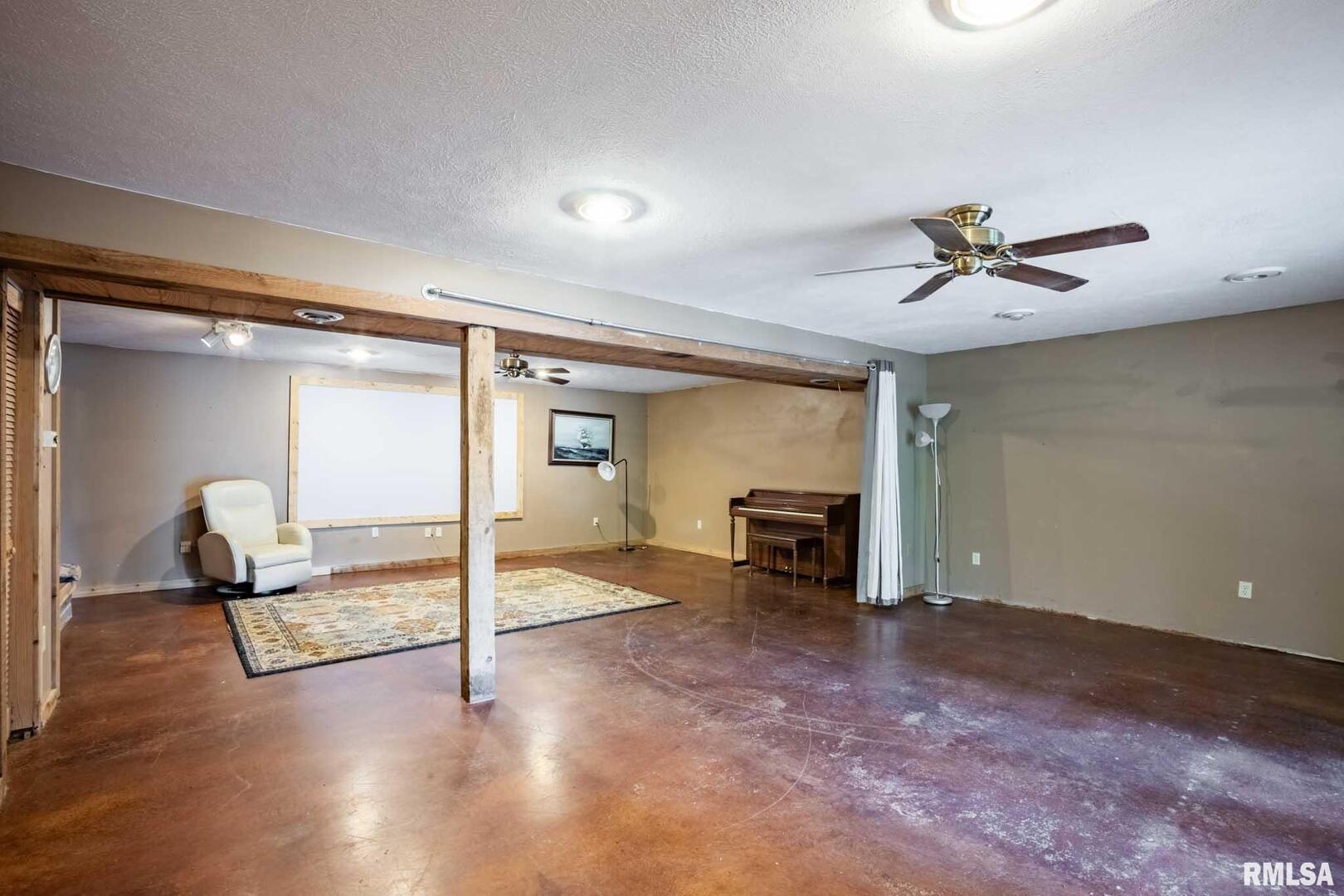 541 Dallas Road Murphysboro, IL 62966 - Photo 36 of 78 a view of a livingroom with a fireplace and a ceiling fan
