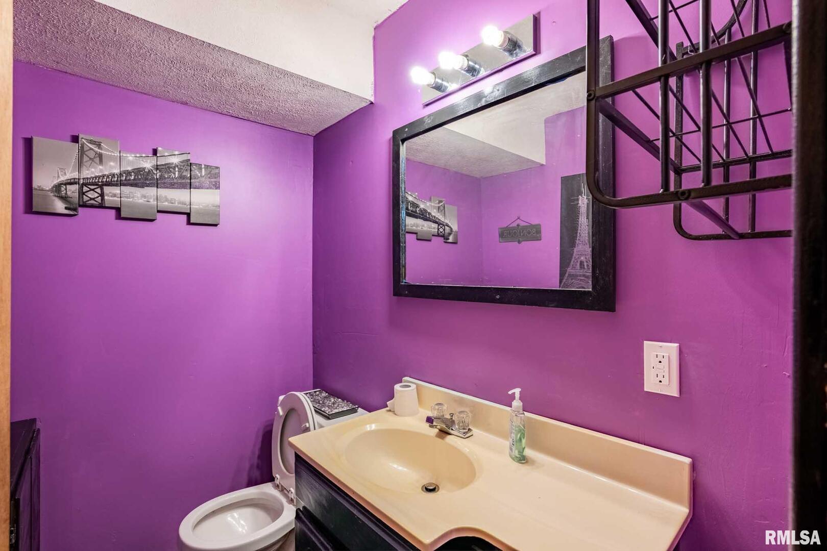 541 Dallas Road Murphysboro, IL 62966 - Photo 41 of 78 a bathroom with a sink and mirror with painted walls