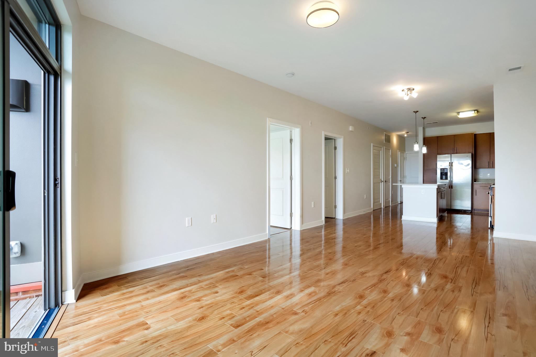 8005 13th Street, Unit 407 Silver Spring, MD 20910 - Photo 5 of 41 Living Room to kitchen area
