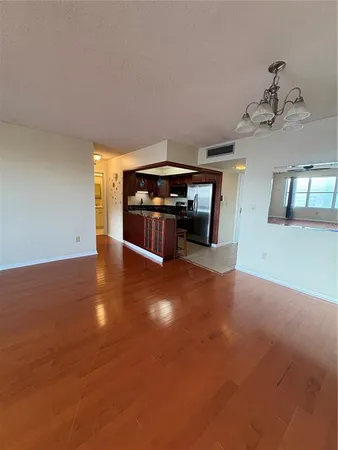 a view of a livingroom with furniture hardwood floor and a ceiling fan
