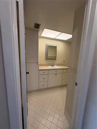 a bathroom with a sink a mirror and a toilet