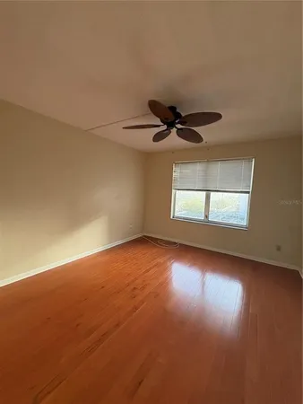 an empty room with a empty space and windows