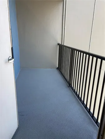 a view of a tall building with a yard