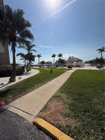 a view of a backyard with chairs