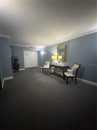 a living room with furniture and a piano