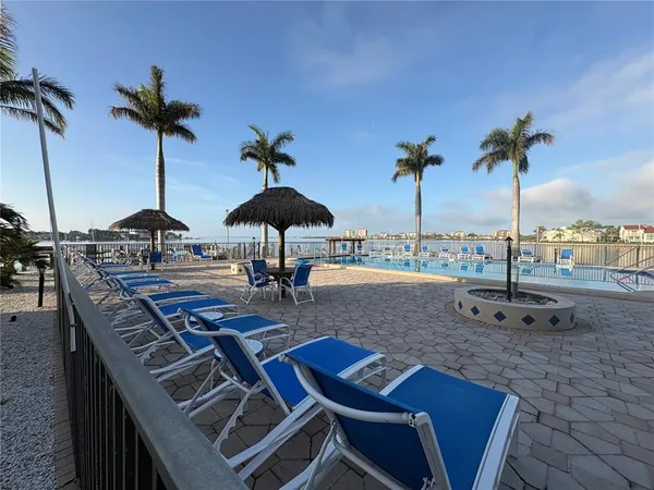 a view of a kitchen with a sink and a refrigerator