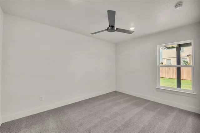 a kitchen with granite countertop stainless steel appliances and wooden cabinets