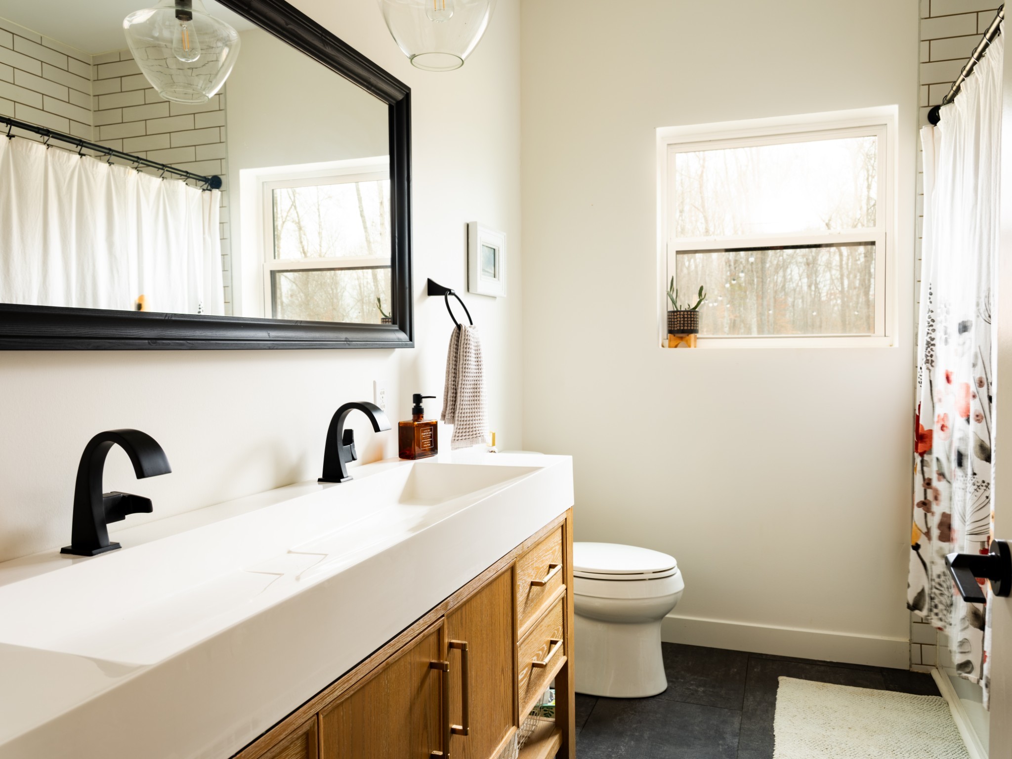 7050 Bakerville Road Waverly, TN 37185 - Photo 24 of 50 a bathroom with a sink a toilet and a window