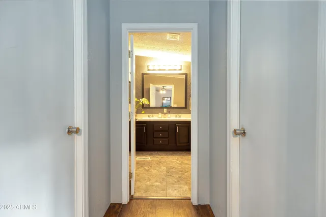 a view of a bathroom from a hallway
