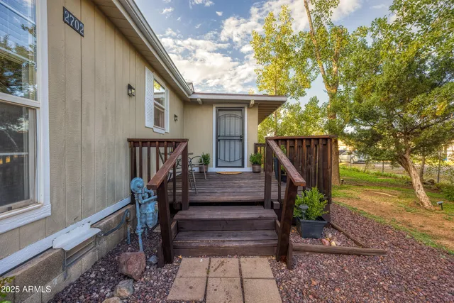 a view of front door of house with stairs