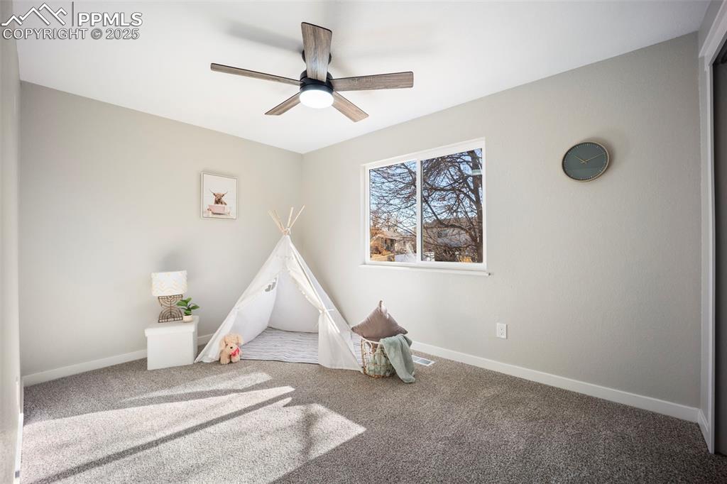 2010 Hampton South Colorado Springs, CO 80906 - Photo 21 of 45 a living room with furniture and a ceiling fan