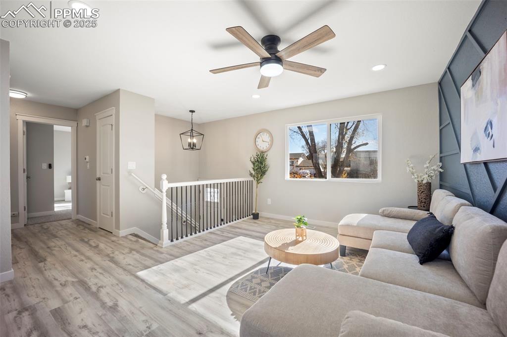 2010 Hampton South Colorado Springs, CO 80906 - Photo 8 of 45 a living room with furniture a window and a ceiling fan