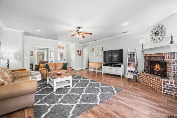 a kitchen with stainless steel appliances granite countertop wooden cabinets a stove top oven a sink and dishwasher