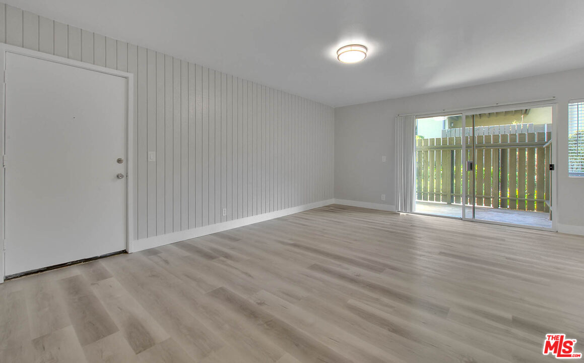 4822 Hollow Corner Road, Unit 177 Culver City, CA 90230 - Photo 13 of 39 wooden floor in an empty room with a window