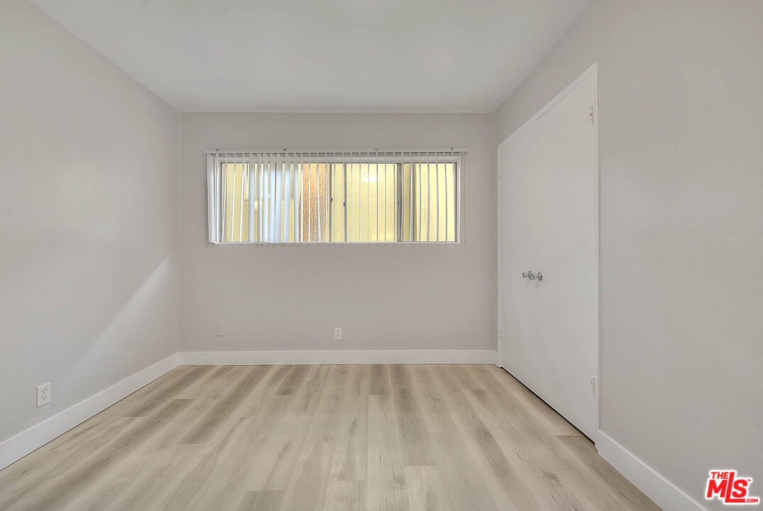 4822 Hollow Corner Road, Unit 177 Culver City, CA 90230 - Photo 19 of 39 wooden floor in an empty room with a window