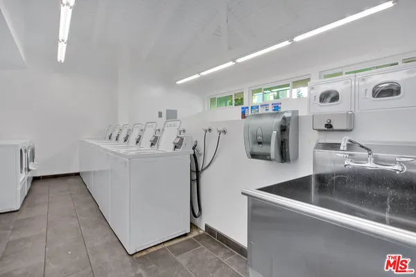 a view of a kitchen with furniture and washer