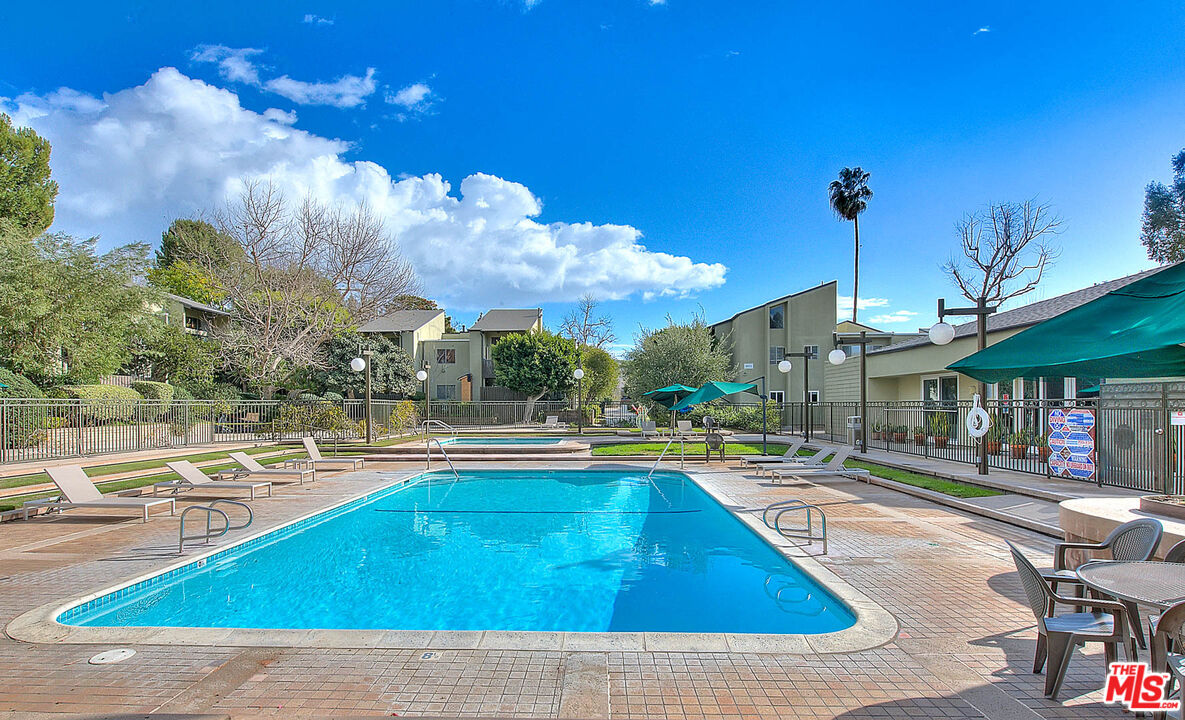 4822 Hollow Corner Road, Unit 177 Culver City, CA 90230 - Photo 33 of 39 a view of a swimming pool with a lounge chairs