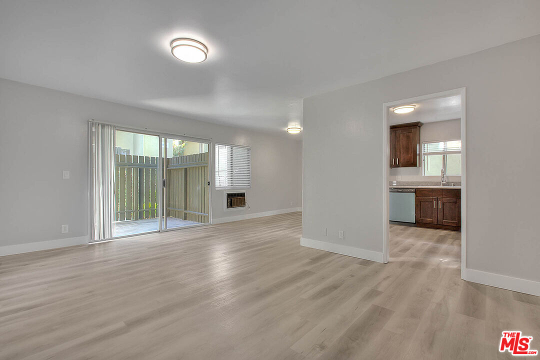 4822 Hollow Corner Road, Unit 177 Culver City, CA 90230 - Photo 5 of 39 wooden floor in an empty room with a window