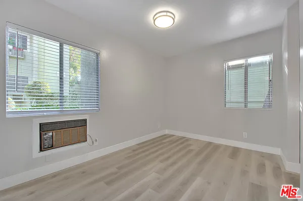 an empty room with a fireplace