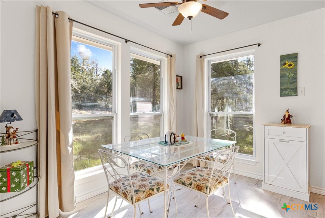 110 Sky Ranch Road Smithville, TX 78957 - Photo 12 of 31 a view of a dining room with furniture window and outside view