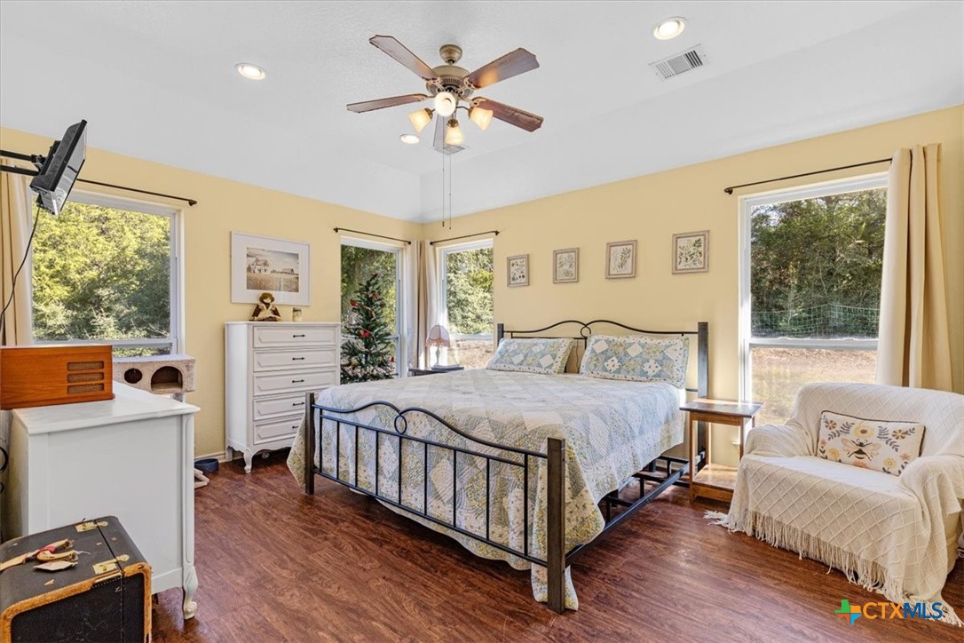 110 Sky Ranch Road Smithville, TX 78957 - Photo 17 of 31 a bedroom with a bed and a couch