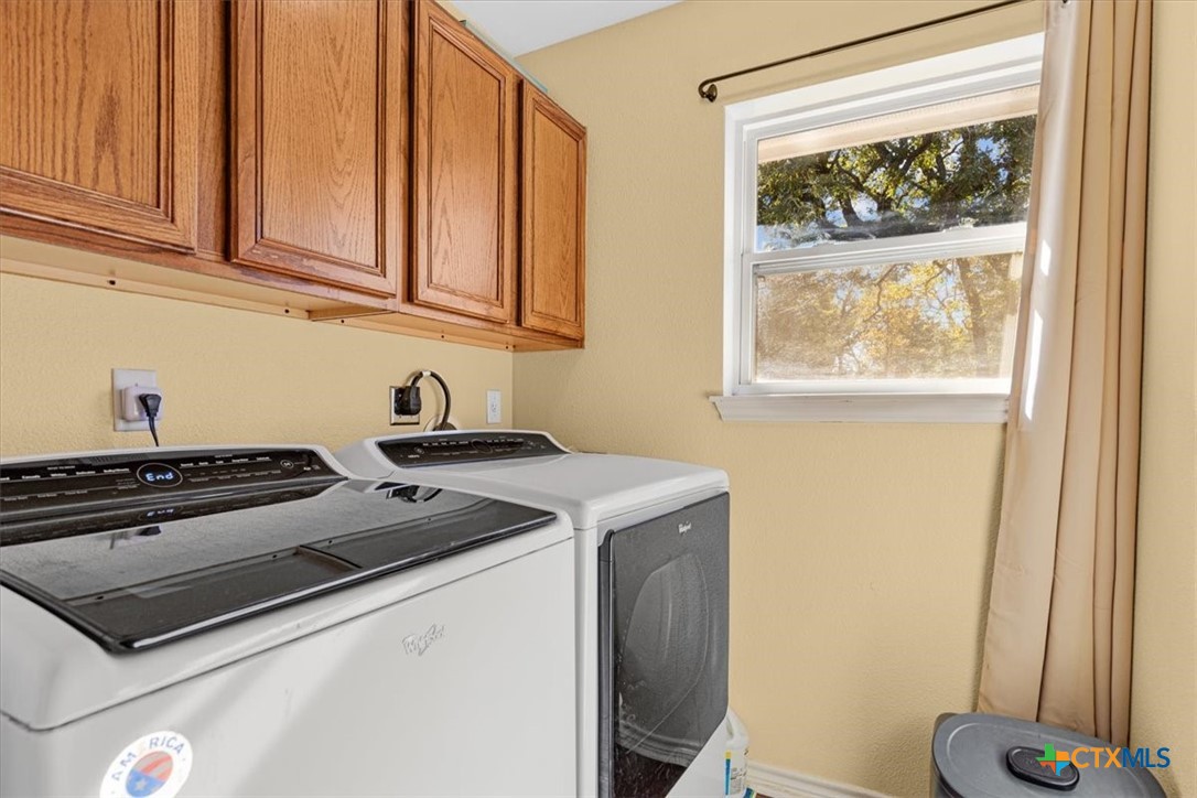 110 Sky Ranch Road Smithville, TX 78957 - Photo 22 of 31 a kitchen with a stove and a window