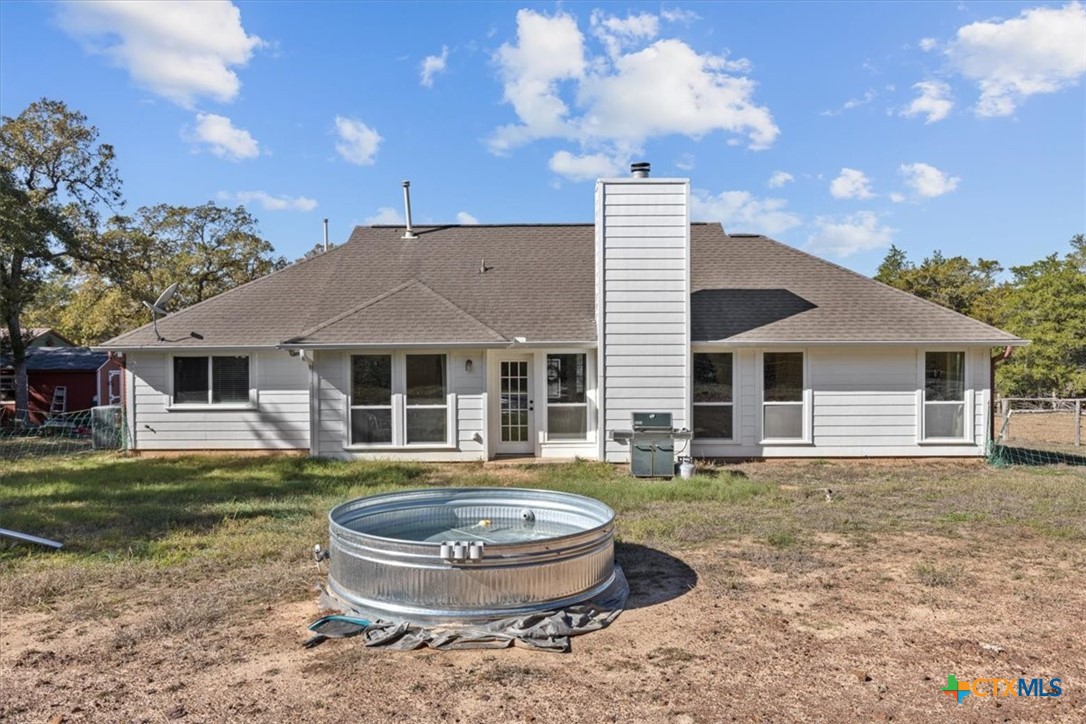 110 Sky Ranch Road Smithville, TX 78957 - Photo 25 of 31 a front view of house with yard and outdoor seating