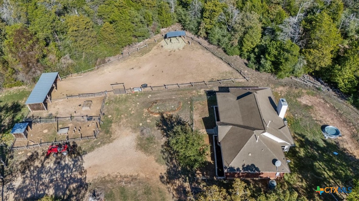 110 Sky Ranch Road Smithville, TX 78957 - Photo 3 of 31 an aerial view of a house with a yard and large trees