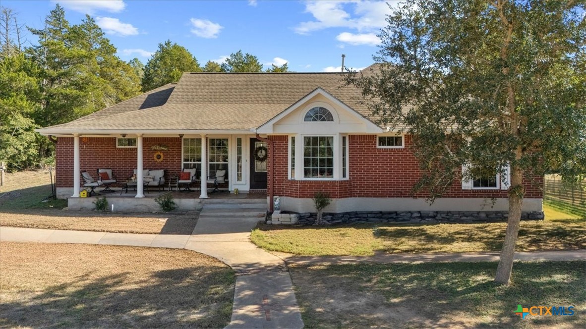 110 Sky Ranch Road Smithville, TX 78957 - Photo 6 of 31 a view of a house with swimming pool and sitting area