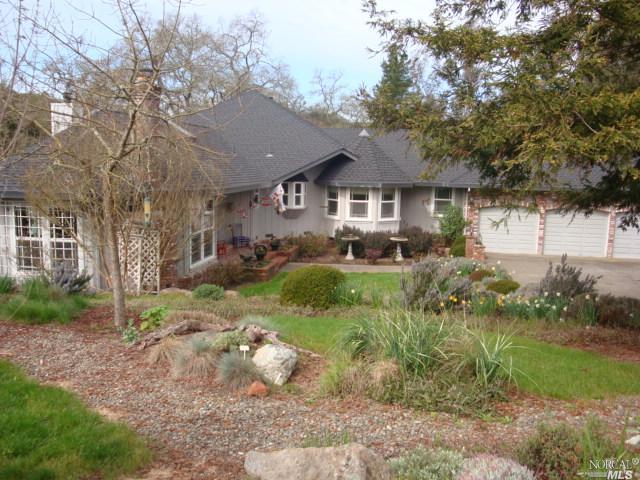 4323 Wallace Road Santa Rosa, CA 95404 - Photo 1 of 1 a view of house in front of a big yard with large trees